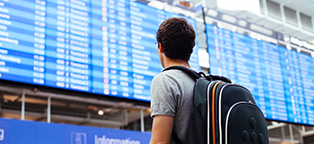 boy with backpack at airport