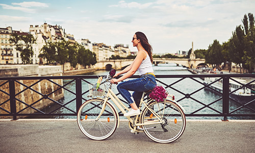 lady on bike in city