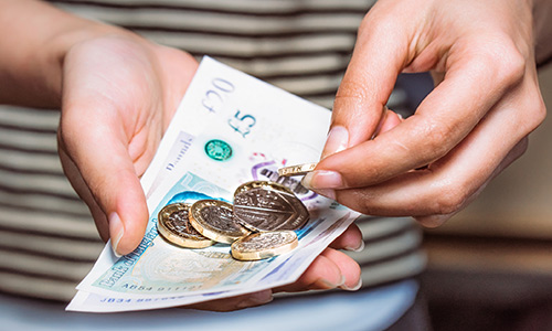 hands with foreign currency